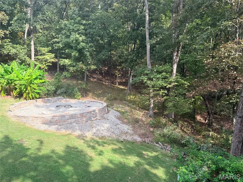 Amazing stone firepit in back yard — 1319 Timber Terra Road, Wildwood, MO 63021