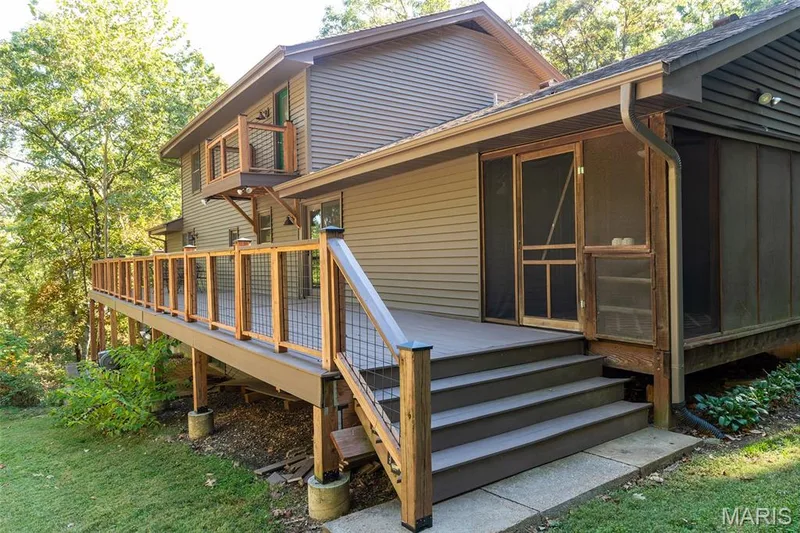 Deck with view of private balcony off of the primary suite — 1319 Timber Terra Road, Wildwood, MO 63021