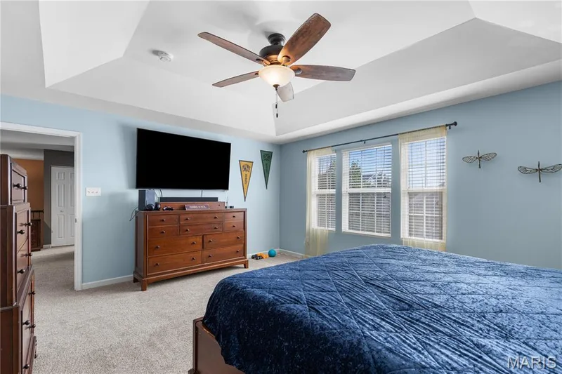 Primary bedroom with coffered ceiling, abundant natural light & room for your largest furniture! — 2542 Amber Willow Court, Lake St. Louis, MO 63367