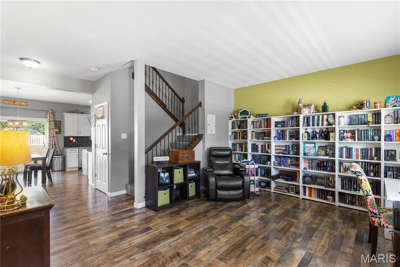Stepping inside, you can see they used the sitting room as a book nook & library! Perfect work from home space! — 2542 Amber Willow Court, Lake St. Louis, MO 63367