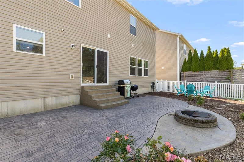 Huge stamped patio with landscaping surround & a fire pit for relaxing fall nights! — 2542 Amber Willow Court, Lake St. Louis, MO 63367