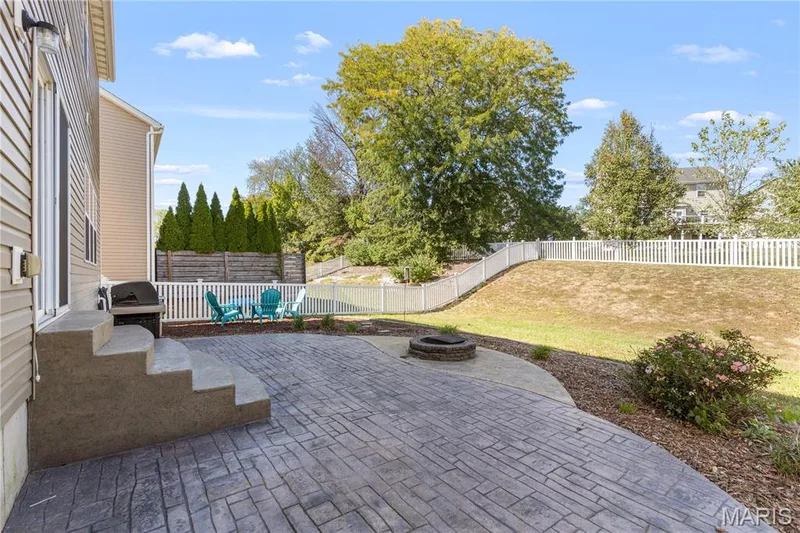 This fully fenced backyard could be your own oasis! I can see your veggie garden in the summer & perfect sledding hill in winter! — 2542 Amber Willow Court, Lake St. Louis, MO 63367