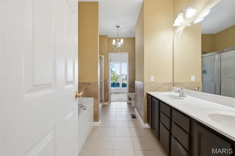 Primary bath with double bowl vanity. — 1615 Wainscott Court, O'Fallon, MO 63366