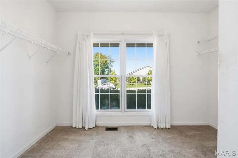 Primary bedroom  massive walk in closet. — 1615 Wainscott Court, O'Fallon, MO 63366