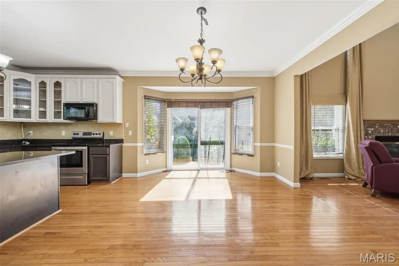 Bay window wit slider that walks out onto a private patio and backyard. — 1615 Wainscott Court, O'Fallon, MO 63366