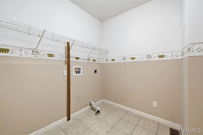 Large main floor laundry plenty of room to sort, fold and dry laundry. — 1615 Wainscott Court, O'Fallon, MO 63366