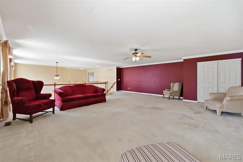 2nd floor loft/bonus room overlooking the great room with a closet and ceiling fan. — 1615 Wainscott Court, O'Fallon, MO 63366