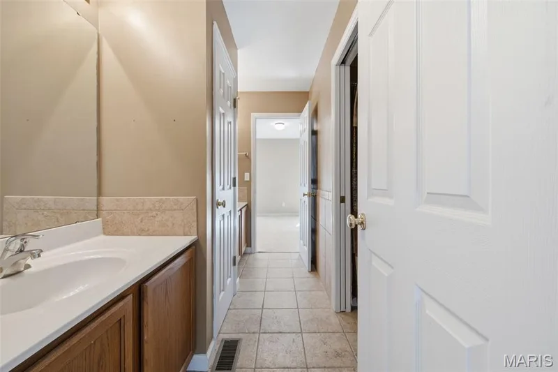 2nd floor Jack and Jill bath with linen closet. — 1615 Wainscott Court, O'Fallon, MO 63366
