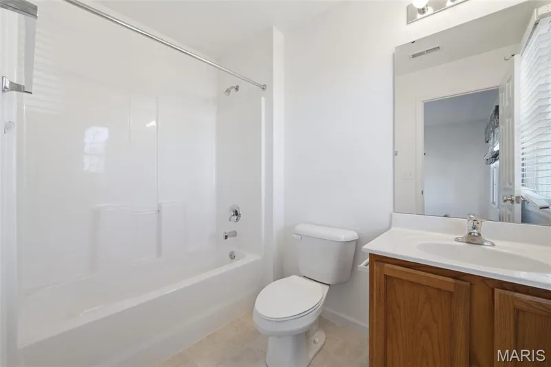 Private bathroom for 2nd floor bedroom. There is a operable window to the right of the vanity too. — 1615 Wainscott Court, O'Fallon, MO 63366