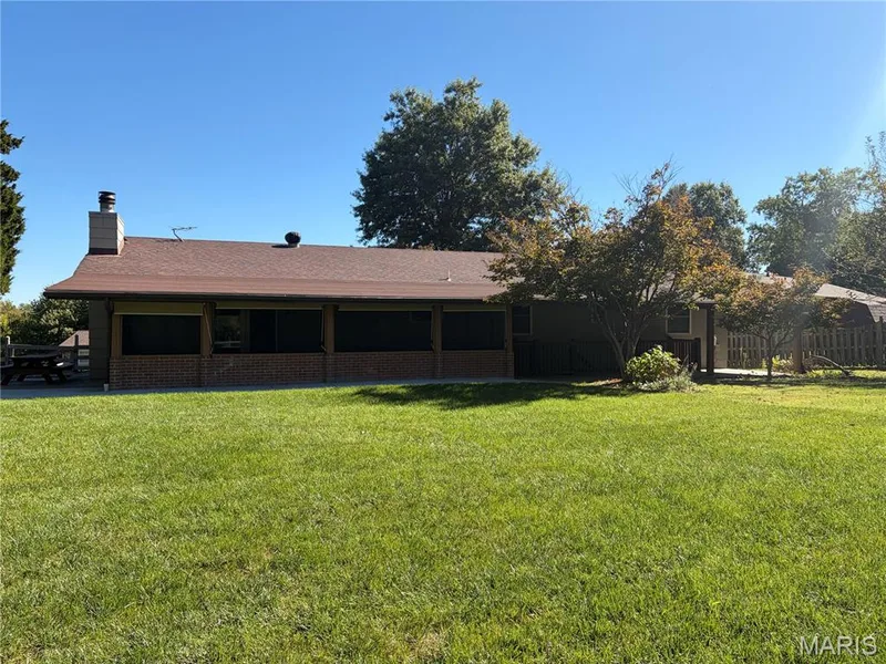 Screened in porch, covered open porch and side patio with picnic table, perfect for outdoor gatherings or peaceful morning coffee. — 357 Beaver Lake Drive, St Charles, MO 63303