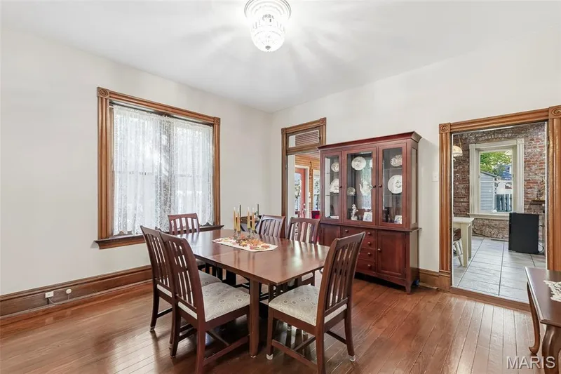 Hardwood flooring, original wood casing, and crown molding — 711 N 5th Street, St Charles, MO 63301