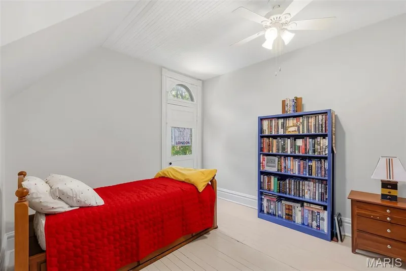 Beadboard ceiling, arched window detail, and light-toned wood-finish flooring — 711 N 5th Street, St Charles, MO 63301