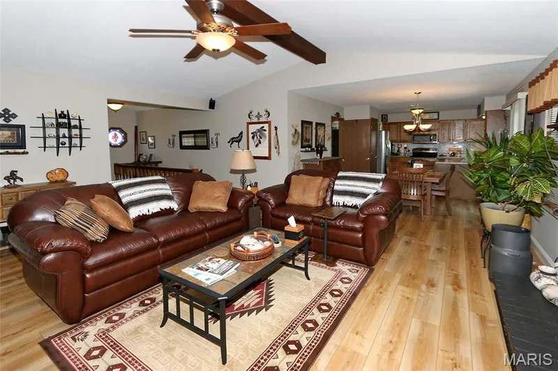 Vaulted ceiling with a wood-finish beam and ceiling fan — 1738 Sun Drop Drive, St Charles, MO 63303