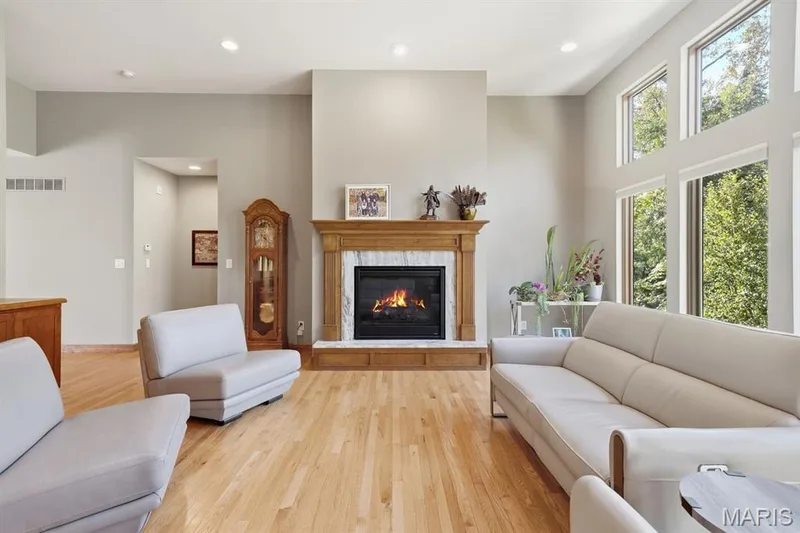 Gas fireplace with wood mantel — 117 Trail Creek Court, St Charles, MO 63304
