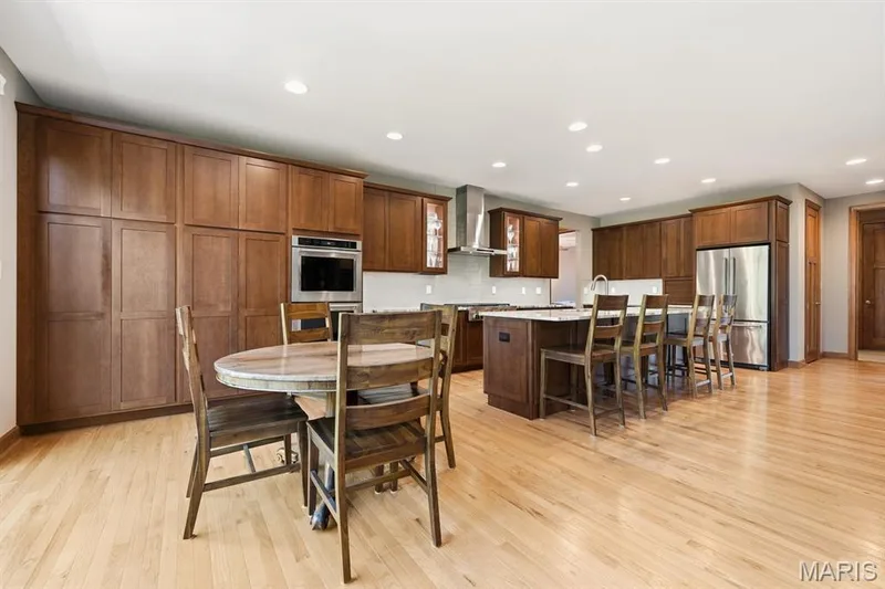 The kitchen has loads of cabinets & pull out storage — 117 Trail Creek Court, St Charles, MO 63304