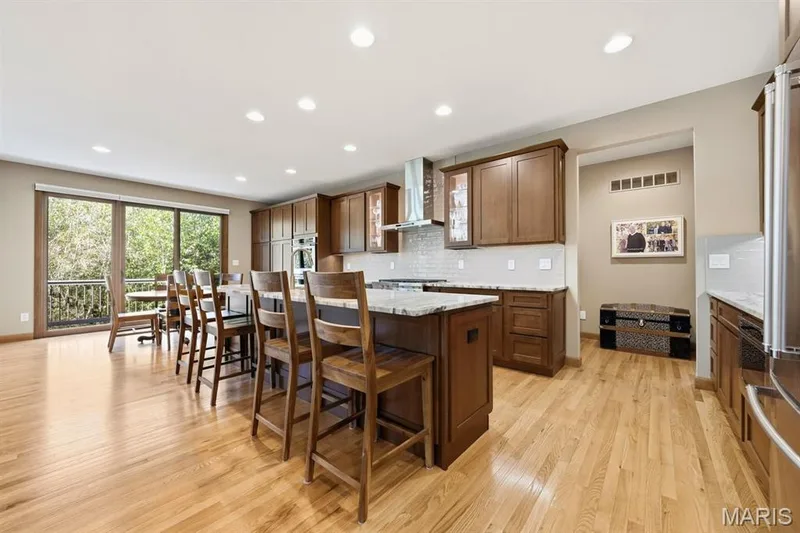 The kitchen has island for extra seating. — 117 Trail Creek Court, St Charles, MO 63304