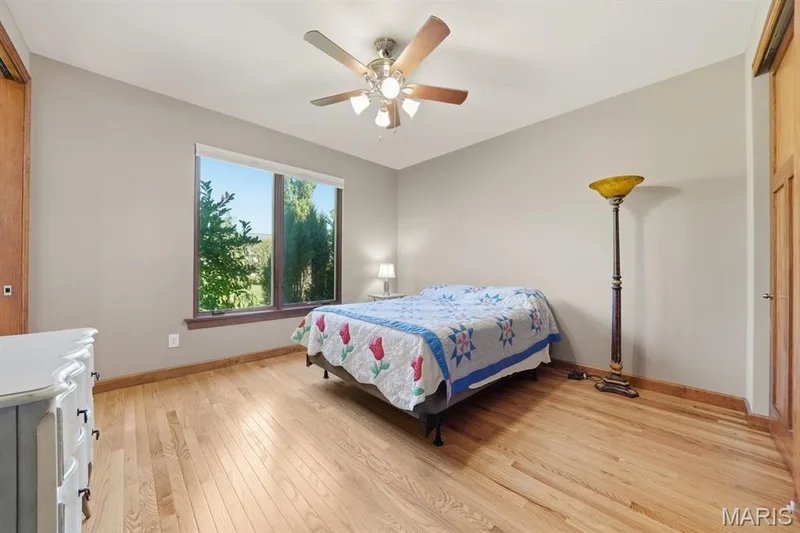 Bedroom 2 with wood floor & ceiling fan — 117 Trail Creek Court, St Charles, MO 63304
