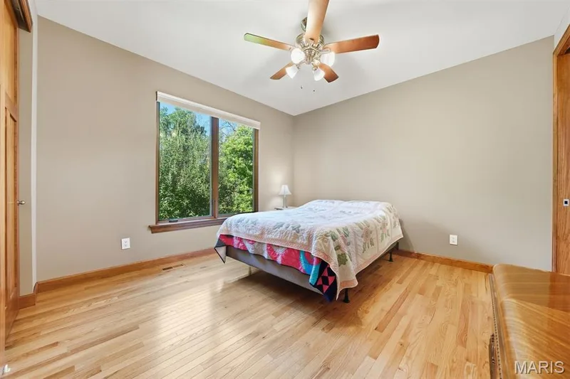 Bedroom 3 with wood floors & ceiling fan — 117 Trail Creek Court, St Charles, MO 63304
