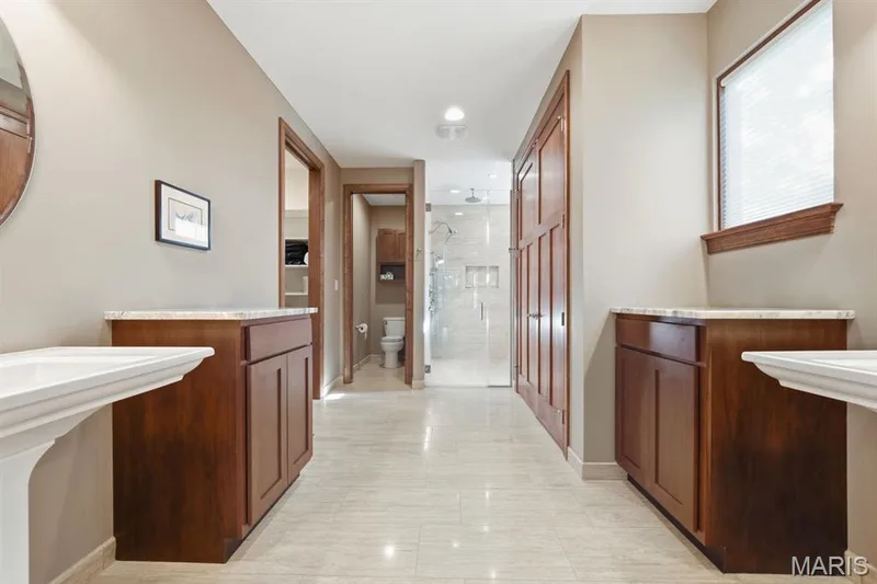 Primary en suite with large walk in shower and dual sinks — 117 Trail Creek Court, St Charles, MO 63304