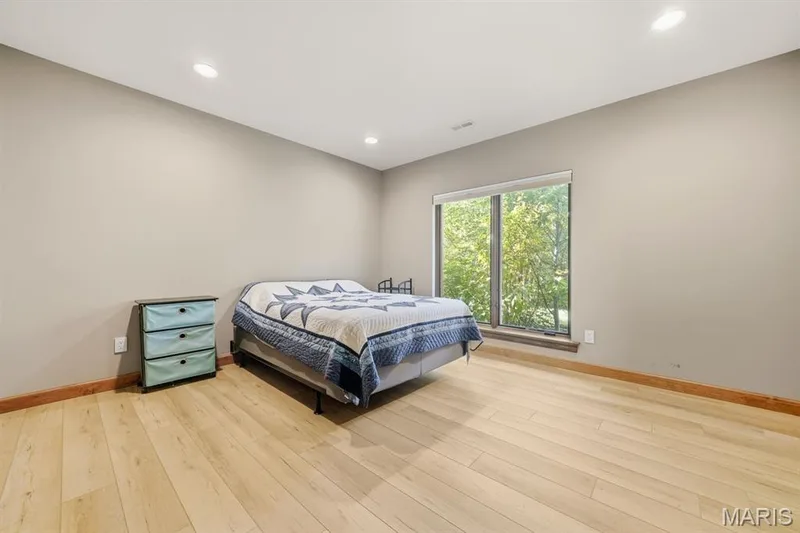 Spacious 4 bedroom in the lower level offers floor to ceiling window and walk in closet — 117 Trail Creek Court, St Charles, MO 63304