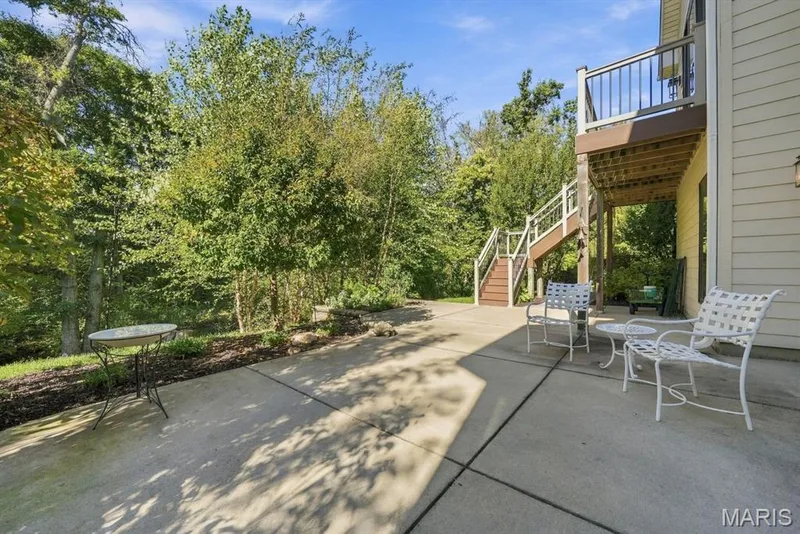 Patio overlooking tree lined backyard — 117 Trail Creek Court, St Charles, MO 63304