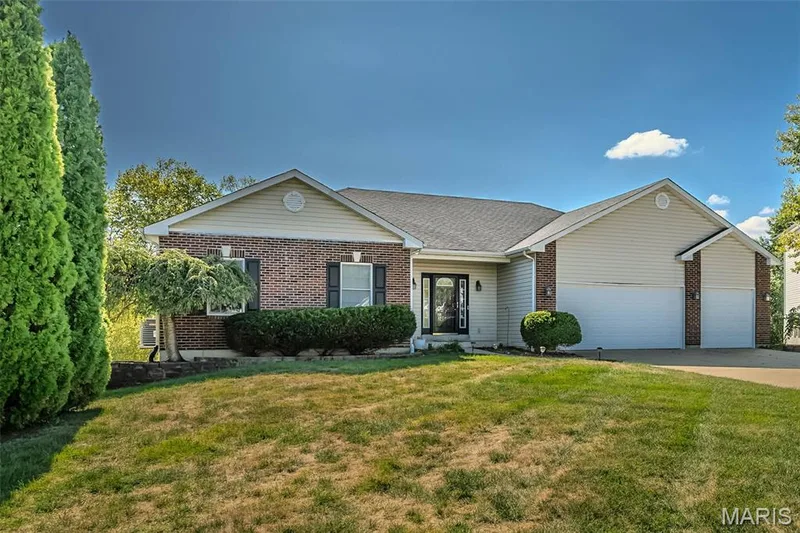 This is a charming neighborhood with the popular Emge Elementary School around the corner.  With a driveway large enough to land a helicopter, but perfect for big wheels and what a canvas for some chalk art. — 84 Reuben Court, O'Fallon, MO 63376