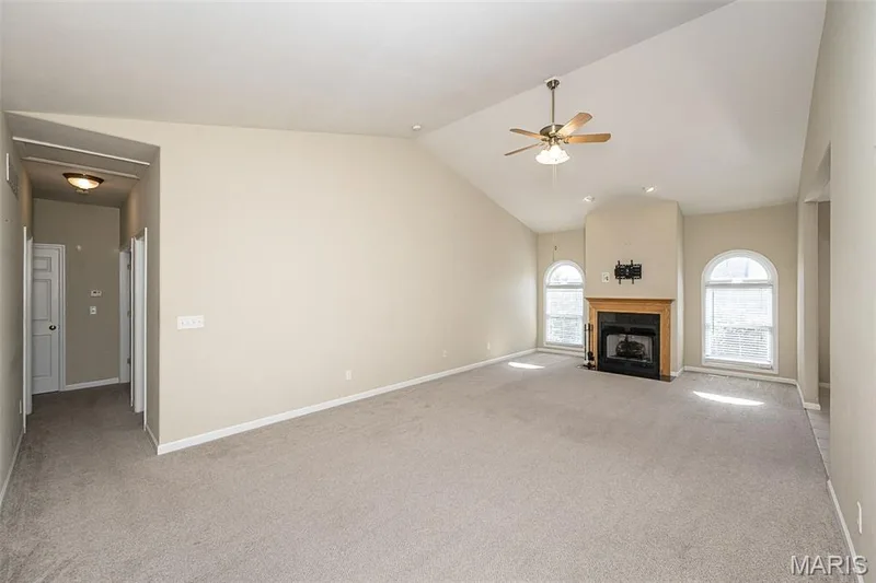 Great Room is almost 27 foot long.  The windows over look the rear lawn area. — 84 Reuben Court, O'Fallon, MO 63376