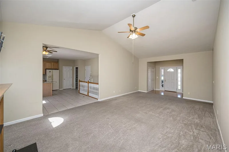 A view from the hearth area toward the main entry with double guest closet. — 84 Reuben Court, O'Fallon, MO 63376