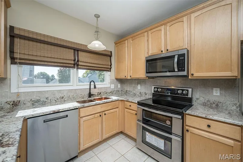 Newer stainless  appliances in 2024.The Kitchen features a new hammered copper large sink. — 84 Reuben Court, O'Fallon, MO 63376