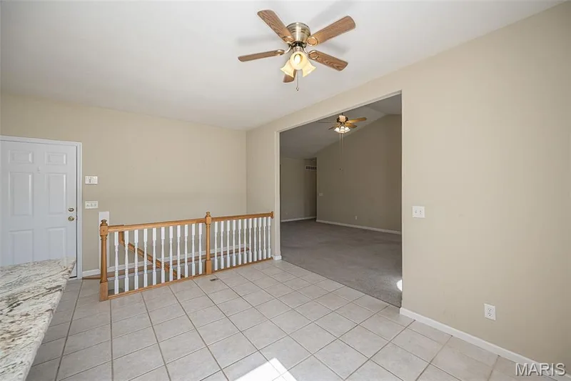 The door at the top of stairs leads to the 4 Car Garage on this level. — 84 Reuben Court, O'Fallon, MO 63376