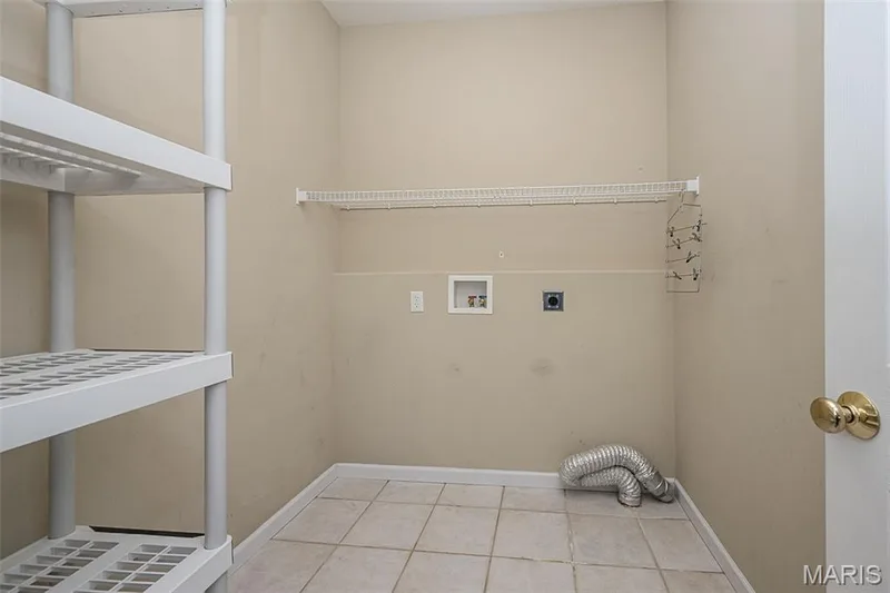 The main Floor Laundry Room.  The convenience that it can remain private without traffic flow to the garage. — 84 Reuben Court, O'Fallon, MO 63376