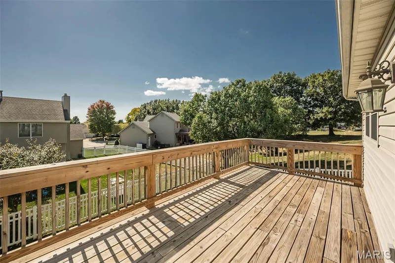 The newer entertainment deck (2024). — 84 Reuben Court, O'Fallon, MO 63376