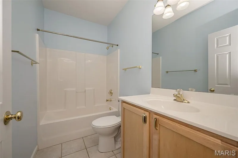 The Main Level hall bath serving Bedrooms 2 and 3. — 84 Reuben Court, O'Fallon, MO 63376