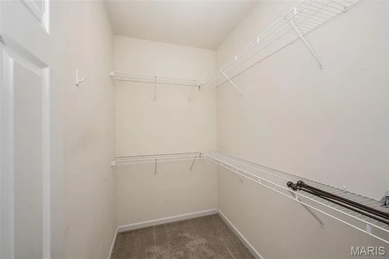 Interior view of primary walk-in closet. — 84 Reuben Court, O'Fallon, MO 63376