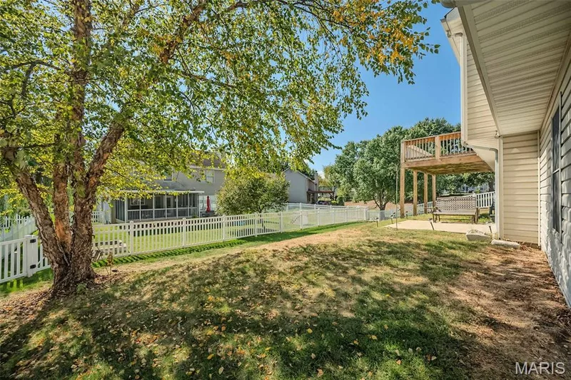 A view of the fenced rear yard. — 84 Reuben Court, O'Fallon, MO 63376