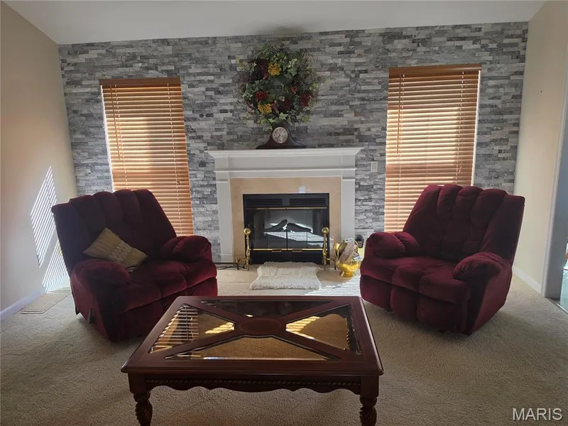 LIVING ROOM WITH CUSTOM FIREPLACE — 1062 Highland Estates Drive, Wentzville, MO 63385