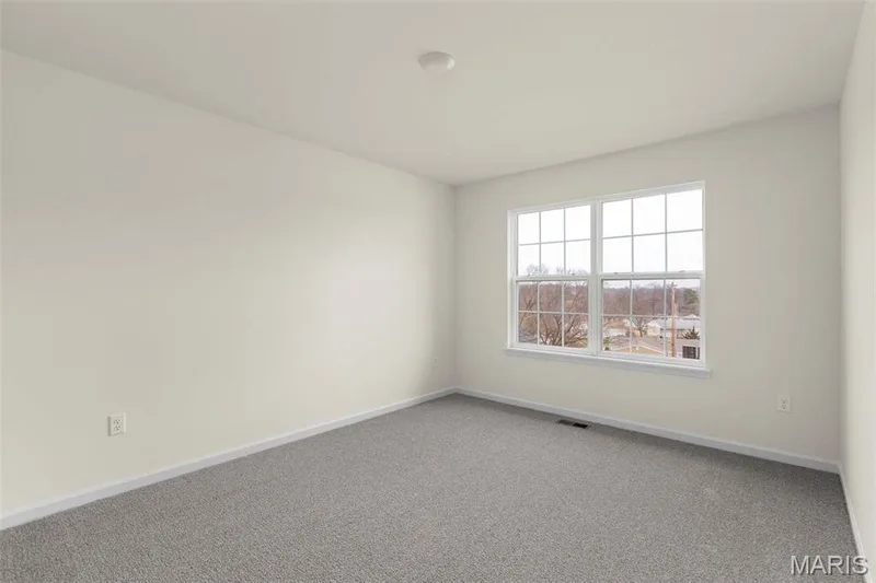 View of carpeted spare room — 2 Sequoia at Elm Crossing, St Charles, MO 63301