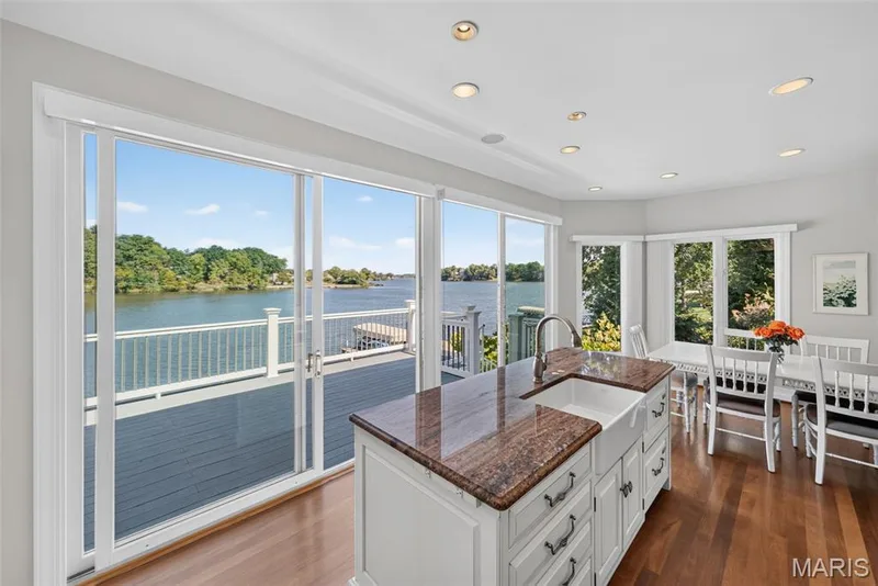 Kitchen opens to the deck overlooking the lake — 33 Moorings Drive, Lake St. Louis, MO 63367