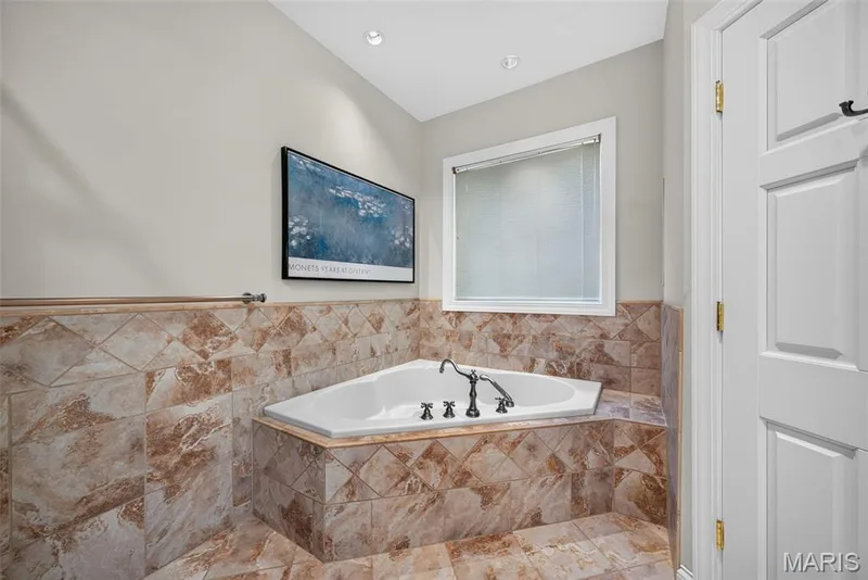 Large whirlpool tub in primary bathroom — 33 Moorings Drive, Lake St. Louis, MO 63367