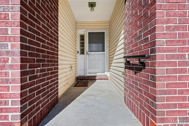 Brick exterior walls with neutral-toned siding — 2006 Chapel Hill Crossing, St Peters, MO 63376