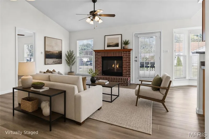 Vaulted ceiling, wood-finish flooring, brick fireplace, ceiling fan, and bay windows — 2006 Chapel Hill Crossing, St Peters, MO 63376