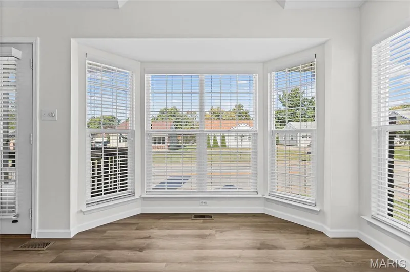 Bay window with multiple panels, wood-finish flooring, and white wall finishes — 2006 Chapel Hill Crossing, St Peters, MO 63376