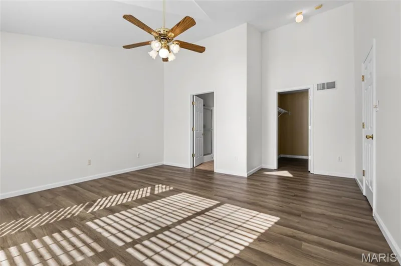 Vaulted ceiling featuring a ceiling fan, wood-finish flooring, recessed lighting, and white walls — 2006 Chapel Hill Crossing, St Peters, MO 63376