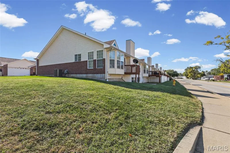 Brick and siding exterior with multiple windows — 2006 Chapel Hill Crossing, St Peters, MO 63376