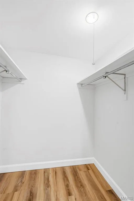 Built-in shelving with hanging rods — 1410 Heritage Landing #106, St Charles, MO 63303