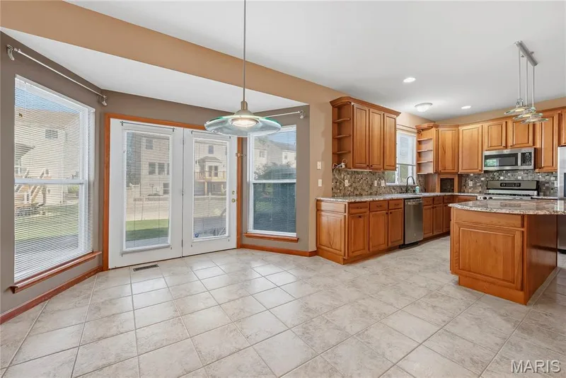 Breakfast room with bay window and tile floors — 28 Wolverton Court, St Charles, MO 63301
