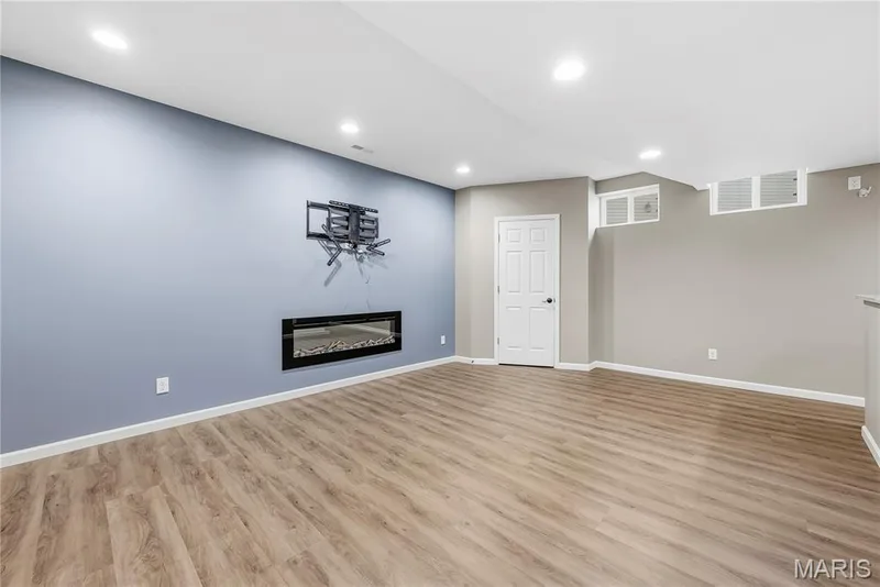 Family room with electric fireplace — 28 Wolverton Court, St Charles, MO 63301