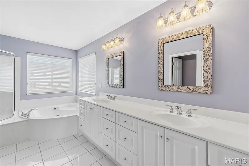 Double sink vanity, whirlpool tub and separate shower — 28 Wolverton Court, St Charles, MO 63301