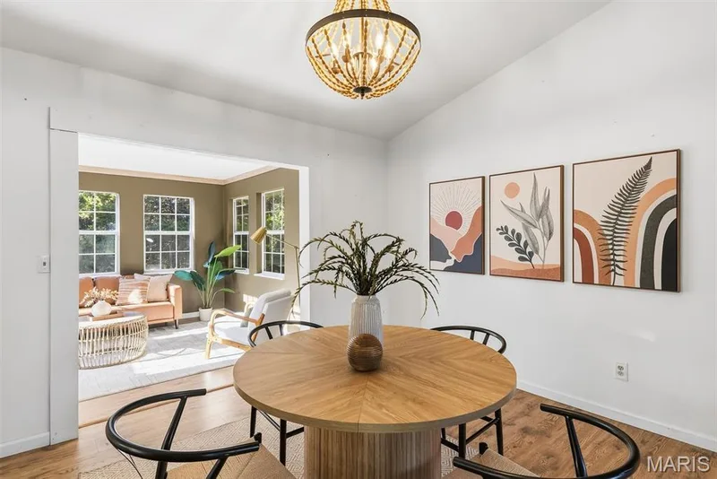 Beaded wood-frame chandelier, neutral wall finish, and wood-finish flooring — 10341 Rose Lane, Foristell, MO 63348