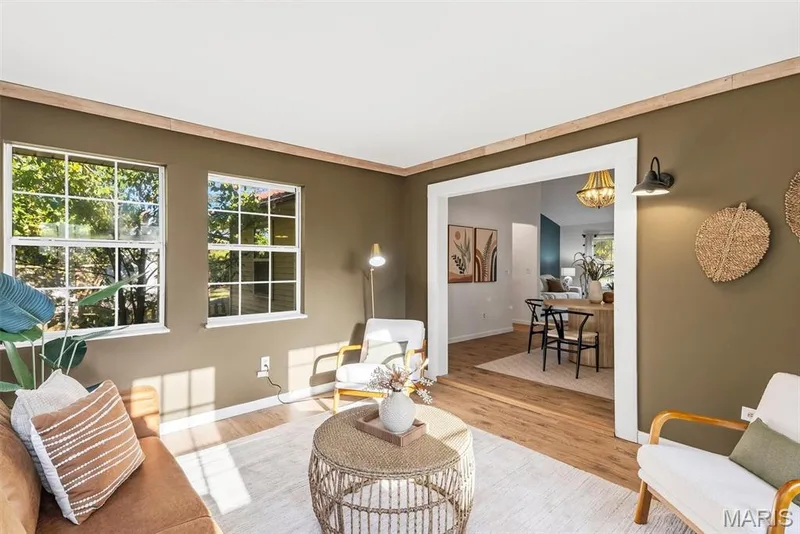 Bonus room/ Interior space featuring wood-finish flooring, multi-pane grid windows, crown molding, and wall-mounted sconce lighting — 10341 Rose Lane, Foristell, MO 63348